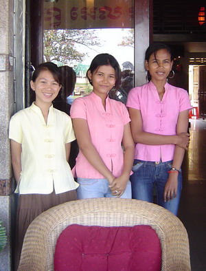 young women in front of hotel