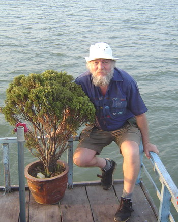 Dave on the boat with the tree