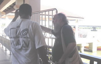talking to the travel shop owner about the boat