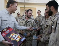 Star pic politician handing out cakes in Afghanistan