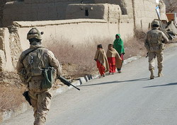 Star pic, soldiers in Afghanistan on road, with kids